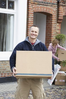 Office relocation planning in Acton with moving boxes and desks