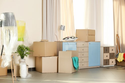 Removal team preparing boxes and furniture safely before loading