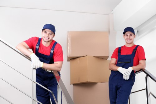 Insured movers handling furniture carefully in Acton
