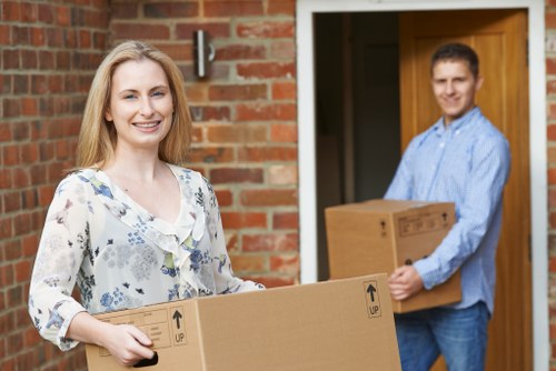 Professional piano removal service handling an upright piano in Acton