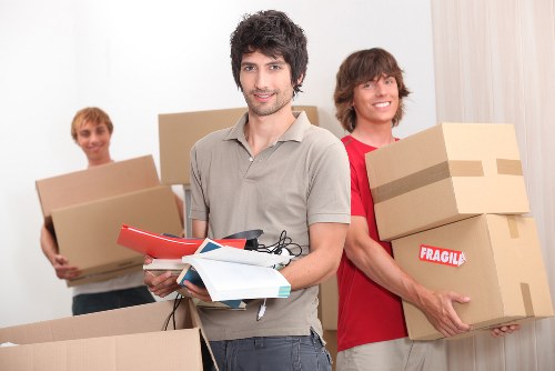 Apartment moving team handling furniture in Acton