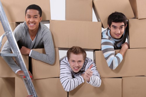 Loading furniture into a removals van for an Acton move