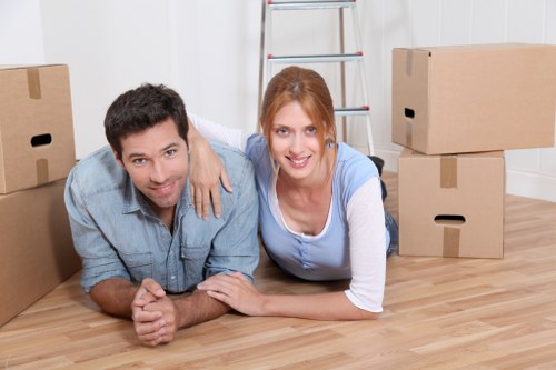Professional removals team following a safety policy during loading