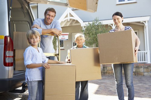 Packed household items and furniture ready for transport in Acton