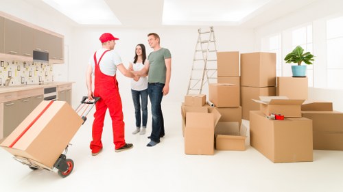 Removal staff using safe handling equipment during a move