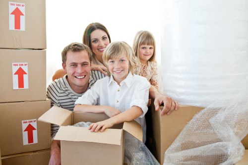 Packed boxes and furniture ready for a house move in Acton